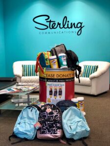 Sterling Communications gathers backpacks for back-to-school season.